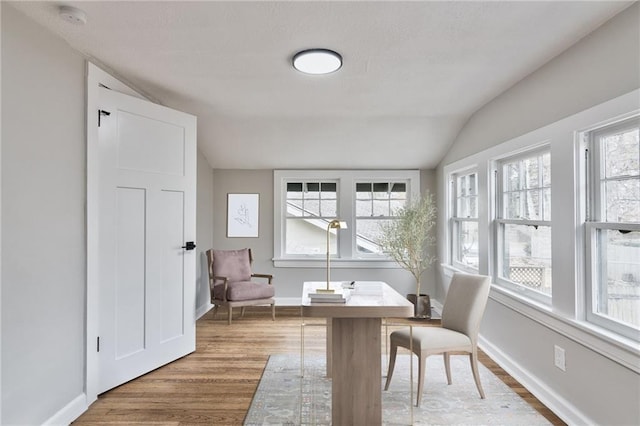 5740 Oak St, Kansas City, MO 64113 - home office with lofted ceiling and wood finished floors