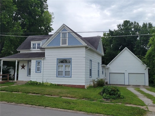 201 W Royle St, Richmond, MO 64085 - view of front facade featuring a garage, dirt driveway, a front lawn, an outdoor structure, and a shingled roof