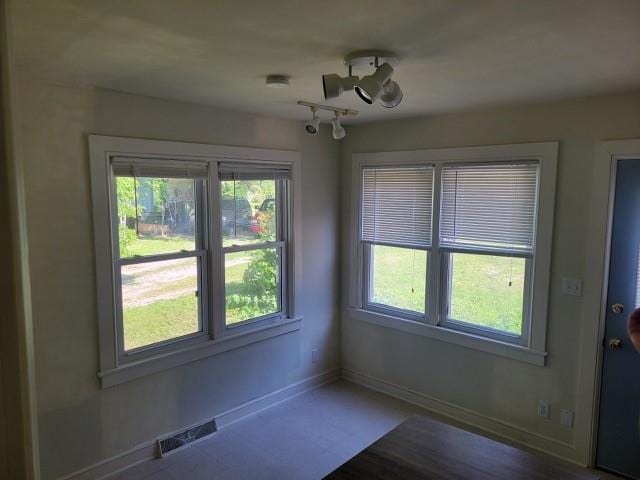 201 W Royle St, Richmond, MO 64085 - unfurnished dining area with plenty of natural light and a chandelier