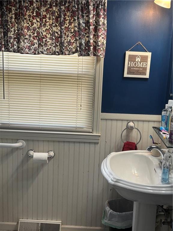 201 W Royle St, Richmond, MO 64085 - bathroom featuring a wainscoted wall