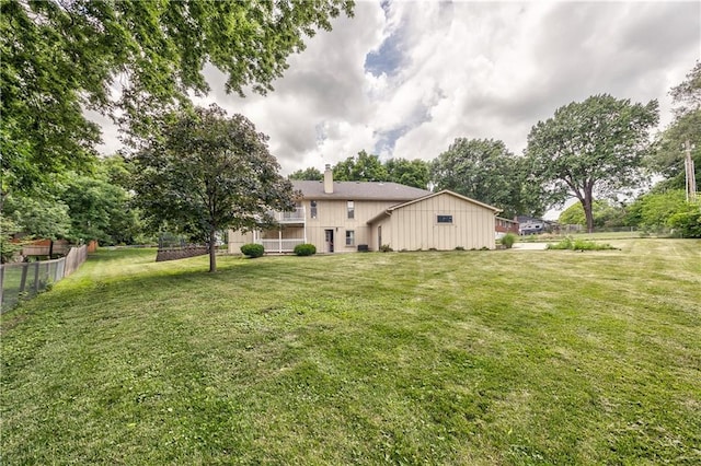 10706 W 50th Ter, Shawnee, KS 66203 - rear view of property featuring board and batten siding and a chimney