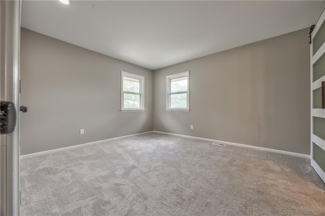 10706 W 50th Ter, Shawnee, KS 66203 - spare room featuring carpet