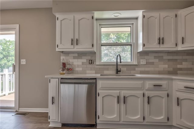 10706 W 50th Ter, Shawnee, KS 66203 - kitchen featuring dishwasher, tasteful backsplash, white cabinets, and light countertops