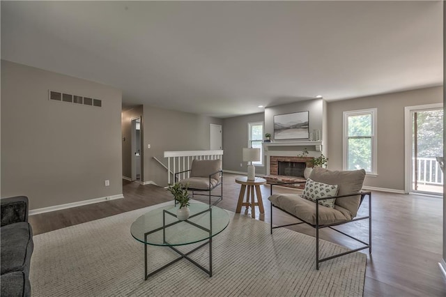 10706 W 50th Ter, Shawnee, KS 66203 - living area featuring wood finished floors and a fireplace