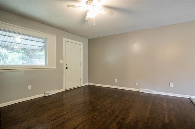 531 S Cedar Ave, Independence, MO 64053 - empty room featuring dark wood-style floors and a ceiling fan