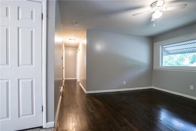 531 S Cedar Ave, Independence, MO 64053 - unfurnished room with wood finished floors, a textured ceiling, and ceiling fan