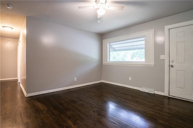 531 S Cedar Ave, Independence, MO 64053 - unfurnished room with wood finished floors, a ceiling fan, and a textured ceiling