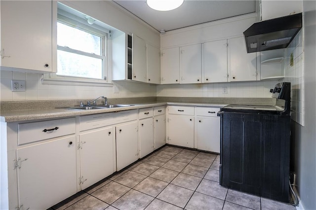 531 S Cedar Ave, Independence, MO 64053 - kitchen with range with electric stovetop, ventilation hood, tasteful backsplash, white cabinetry, and crown molding