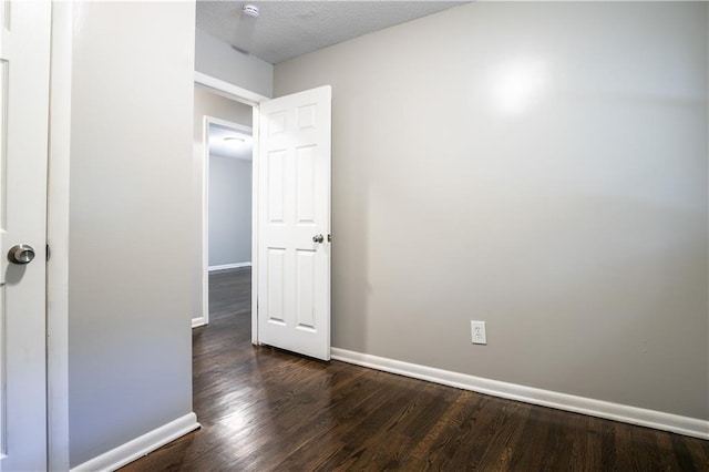 531 S Cedar Ave, Independence, MO 64053 - empty room featuring dark wood finished floors and a smoke detector