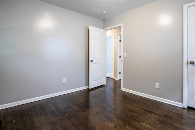 531 S Cedar Ave, Independence, MO 64053 - empty room with baseboards and dark wood-style floors