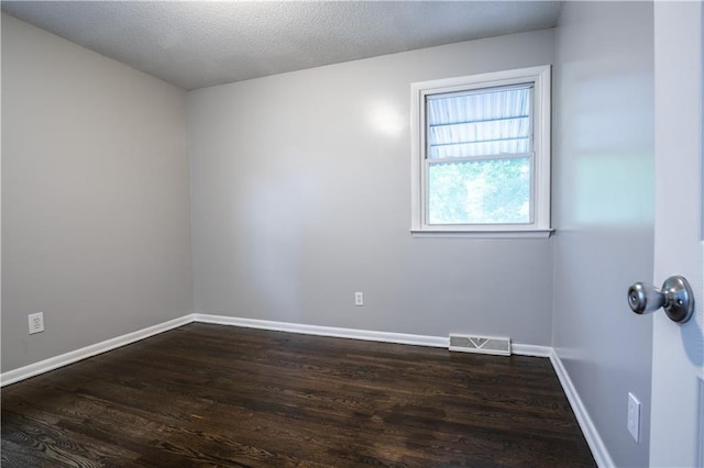 531 S Cedar Ave, Independence, MO 64053 - spare room featuring dark wood finished floors