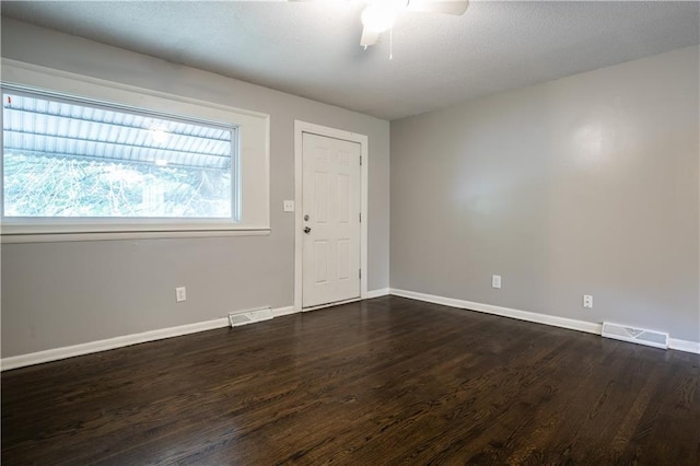 531 S Cedar Ave, Independence, MO 64053 - empty room with dark wood-style flooring and ceiling fan
