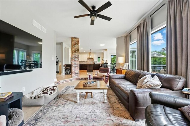 15376 Loring Rd, Bonner Springs, KS 66012 - living area featuring wood finished floors, a ceiling fan, and recessed lighting