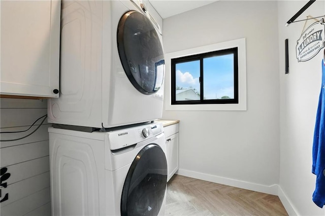 15376 Loring Rd, Bonner Springs, KS 66012 - washroom with estacked washer and dryer and cabinet space