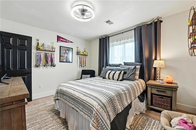 15376 Loring Rd, Bonner Springs, KS 66012 - bedroom with wood finished floors and baseboards