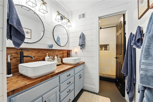 15376 Loring Rd, Bonner Springs, KS 66012 - bathroom featuring double vanity and ornamental molding