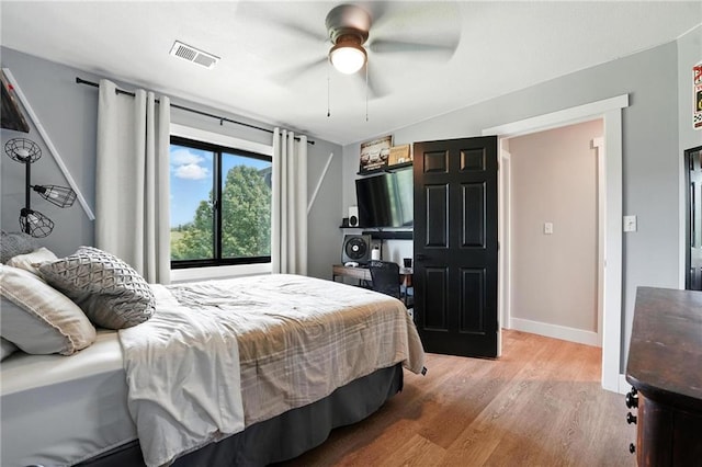 15376 Loring Rd, Bonner Springs, KS 66012 - bedroom with wood finished floors and ceiling fan
