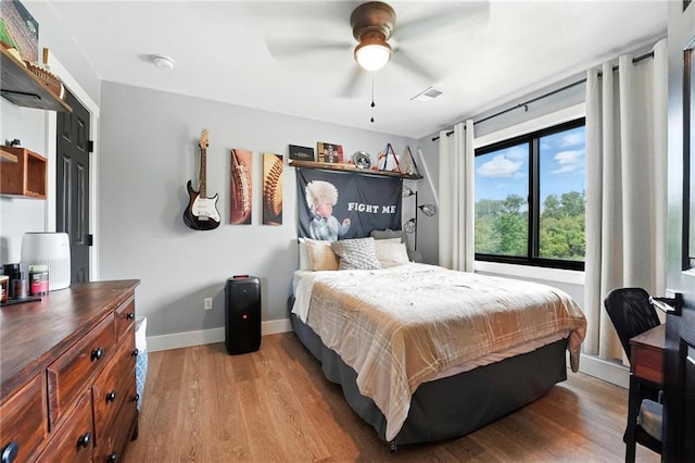 15376 Loring Rd, Bonner Springs, KS 66012 - bedroom with wood finished floors and a ceiling fan