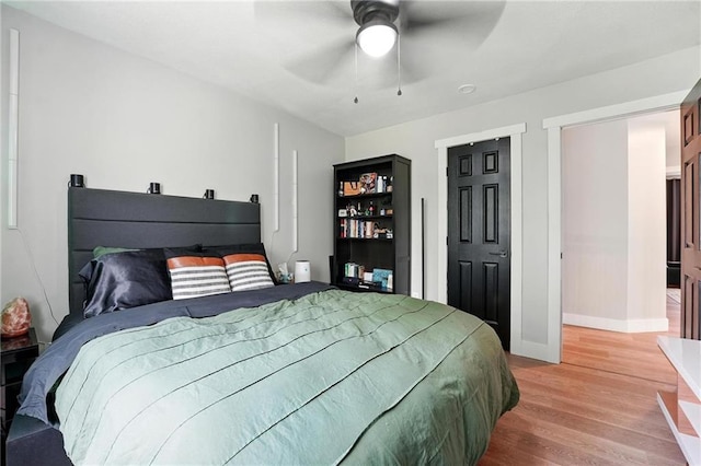 15376 Loring Rd, Bonner Springs, KS 66012 - bedroom with light wood-style floors and ceiling fan