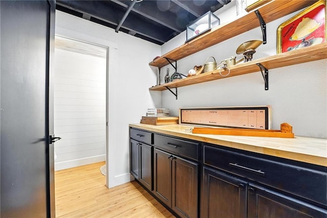 15376 Loring Rd, Bonner Springs, KS 66012 - bar with light wood-style flooring and baseboards