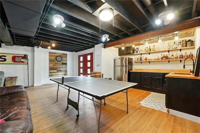 15376 Loring Rd, Bonner Springs, KS 66012 - playroom featuring wet bar and light wood finished floors