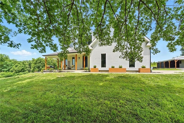 15376 Loring Rd, Bonner Springs, KS 66012 - view of front facade with a front lawn and covered porch