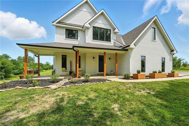 15376 Loring Rd, Bonner Springs, KS 66012 - view of front of house featuring a porch, outdoor lounge area, a front lawn, and a shingled roof
