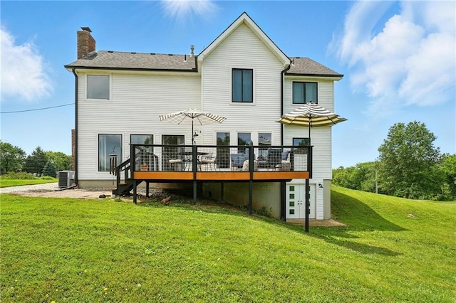 15376 Loring Rd, Bonner Springs, KS 66012 - rear view of house with a wooden deck, a chimney, and a yard