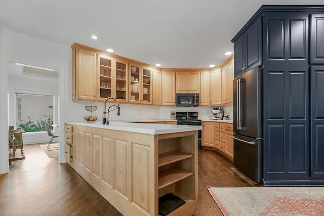 8148 Lingle Ln, Lenexa, KS 66215 - kitchen featuring black appliances, light brown cabinets, dark wood-type flooring, light countertops, and recessed lighting
