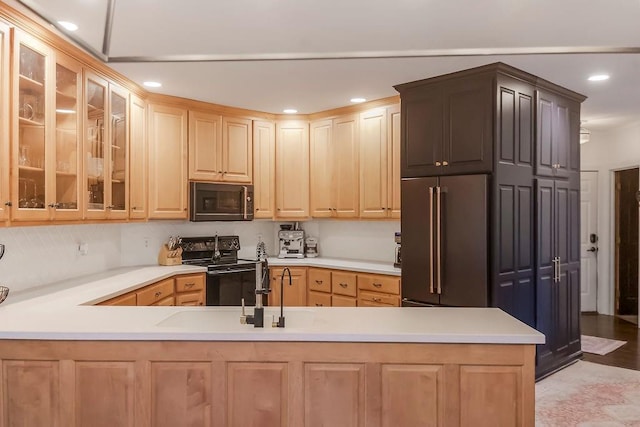 8148 Lingle Ln, Lenexa, KS 66215 - kitchen with stainless steel microwave, high quality fridge, black electric range, light brown cabinets, and glass insert cabinets