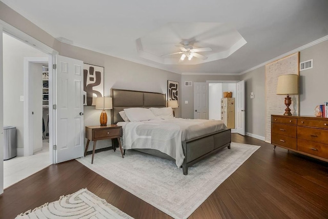 8148 Lingle Ln, Lenexa, KS 66215 - bedroom with a raised ceiling, wood finished floors, crown molding, and ceiling fan