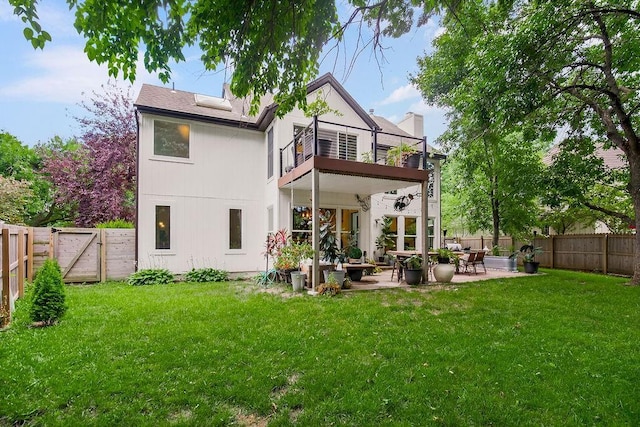 8148 Lingle Ln, Lenexa, KS 66215 - back of house with a balcony, a fenced backyard, a patio, a gate, and a chimney