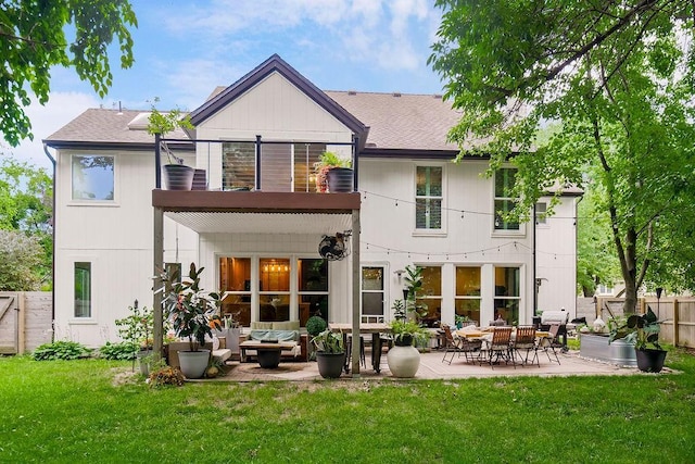 8148 Lingle Ln, Lenexa, KS 66215 - rear view of house featuring a balcony, a fenced backyard, a patio, roof with shingles, and outdoor lounge area