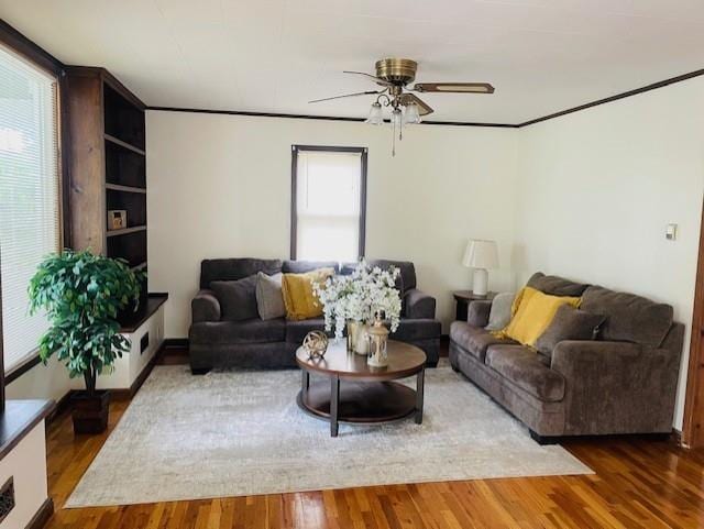 3119 Seneca St, Saint Joseph, MO 64507 - living room featuring a ceiling fan and wood finished floors