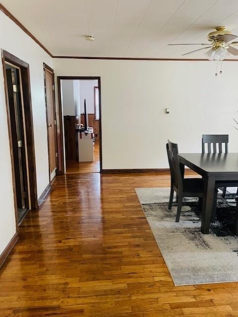 3119 Seneca St, Saint Joseph, MO 64507 - dining space with ornamental molding, wood finished floors, and a ceiling fan