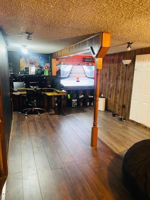 3119 Seneca St, Saint Joseph, MO 64507 - office area with wood finished floors, wooden walls, and a textured ceiling