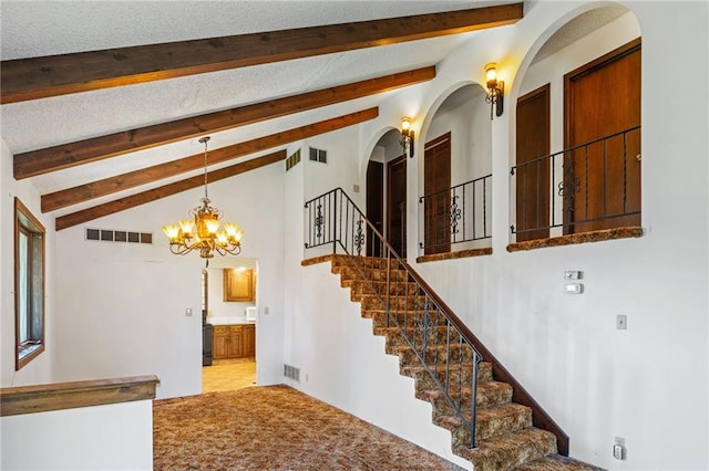 4445 NW 52nd Ter, Topeka, KS 66618 - stairway with arched walkways and a chandelier
