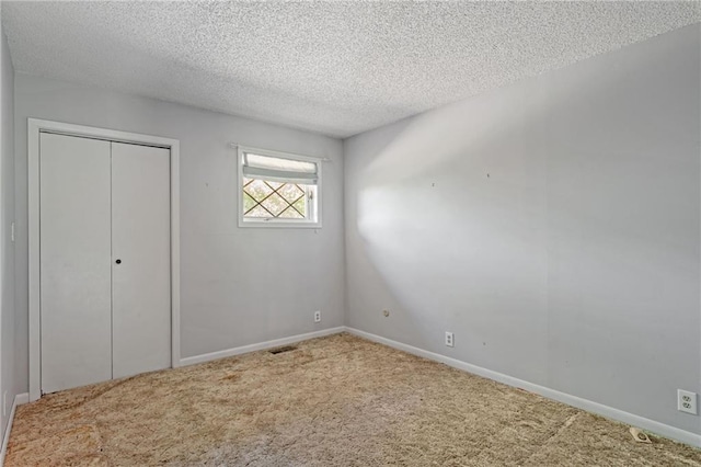 4445 NW 52nd Ter, Topeka, KS 66618 - unfurnished bedroom with carpet, a textured ceiling, and a closet