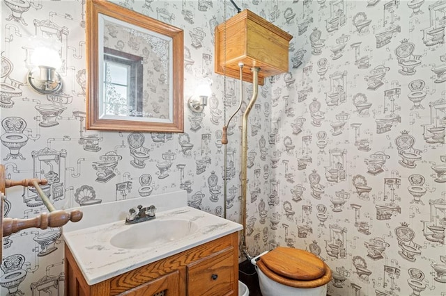 4445 NW 52nd Ter, Topeka, KS 66618 - bathroom featuring wallpapered walls and vanity