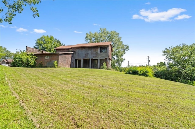 4445 NW 52nd Ter, Topeka, KS 66618 - rear view of house with a yard