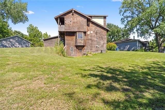 4445 NW 52nd Ter, Topeka, KS 66618 - back of property with a yard and stone siding