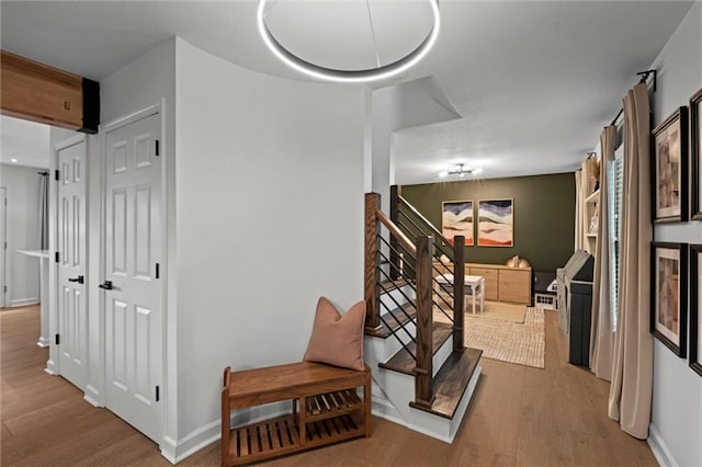 12005 W 100th Ter, Lenexa, KS 66215 - stairs with wood finished floors and baseboards