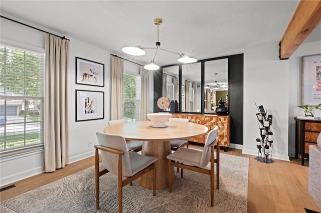 12005 W 100th Ter, Lenexa, KS 66215 - dining space with light wood finished floors