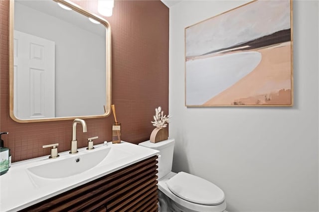 12005 W 100th Ter, Lenexa, KS 66215 - half bathroom with vanity and decorative backsplash