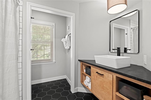12005 W 100th Ter, Lenexa, KS 66215 - bathroom featuring vanity, tile patterned flooring, and curtained shower