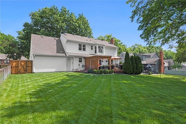 12005 W 100th Ter, Lenexa, KS 66215 - back of property with a fenced backyard, a pergola, a wooden deck, and a chimney