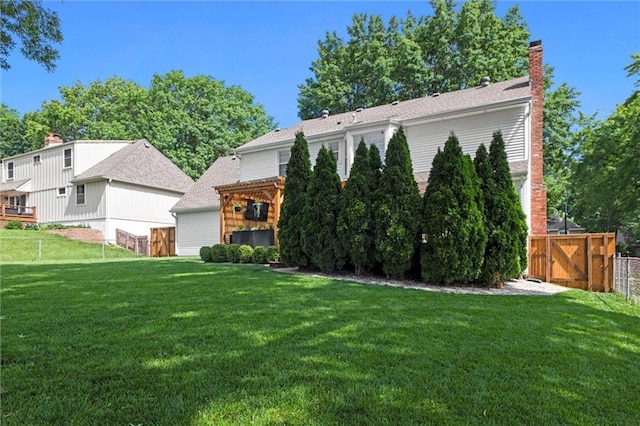 12005 W 100th Ter, Lenexa, KS 66215 - back of property featuring a gate and a chimney