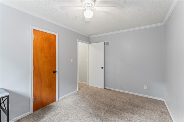 1275 NE Tudor Rd, Lees Summit, MO 64086 - unfurnished bedroom featuring a textured ceiling, carpet flooring, crown molding, and ceiling fan