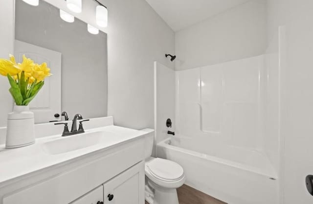 210 S Devin St, Lone Jack, MO 64070 - bathroom with vanity, shower / bathtub combination, and wood finished floors