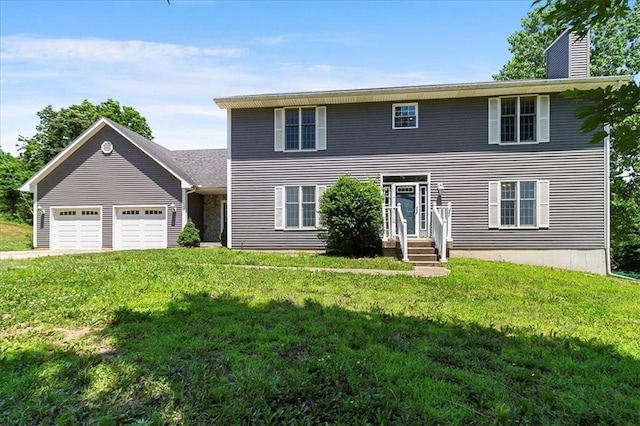 245 SW 400th Rd, Warrensburg, MO 64093 - colonial-style house featuring an attached garage, a chimney, and a front lawn
